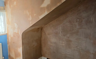 Plaster skim finish on a living room wall in Bridgend