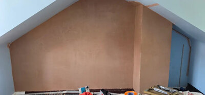 New plaster set applied to a stud wall