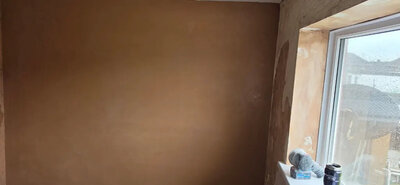 Plastering repair on a damaged wall section